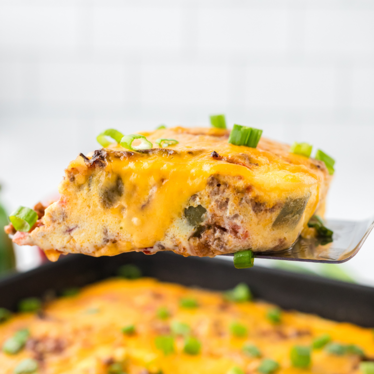 A delicious Air Fryer Taco Casserole with layers of beef, cheese, and tortillas, cooked to crispy perfection and topped with fresh ingredients.