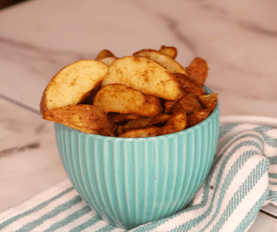 Air fryer Frozen Potato Wedges Cooked and In a bowl