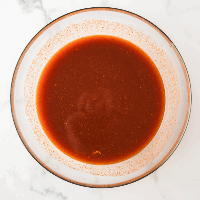 Mixing the ingredients for Copycat McDonald’s Tangy BBQ Sauce in a small mixing bowl.