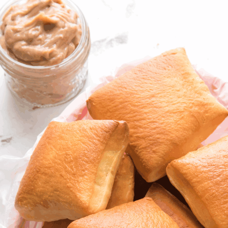 A bowl of homemade Copycat Texas Roadhouse Butter, ready to spread on warm rolls or bread.