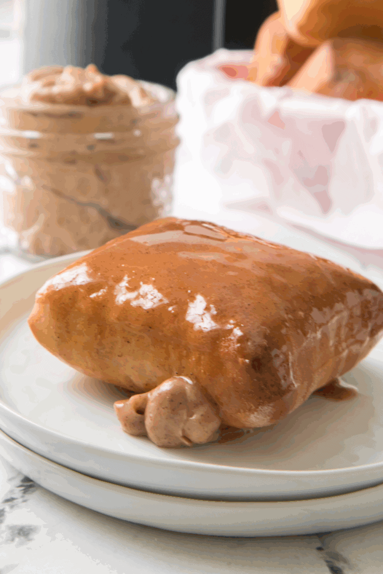 A bowl of creamy Copycat Texas Roadhouse Butter, ready to be spread on fresh, warm rolls or bread.