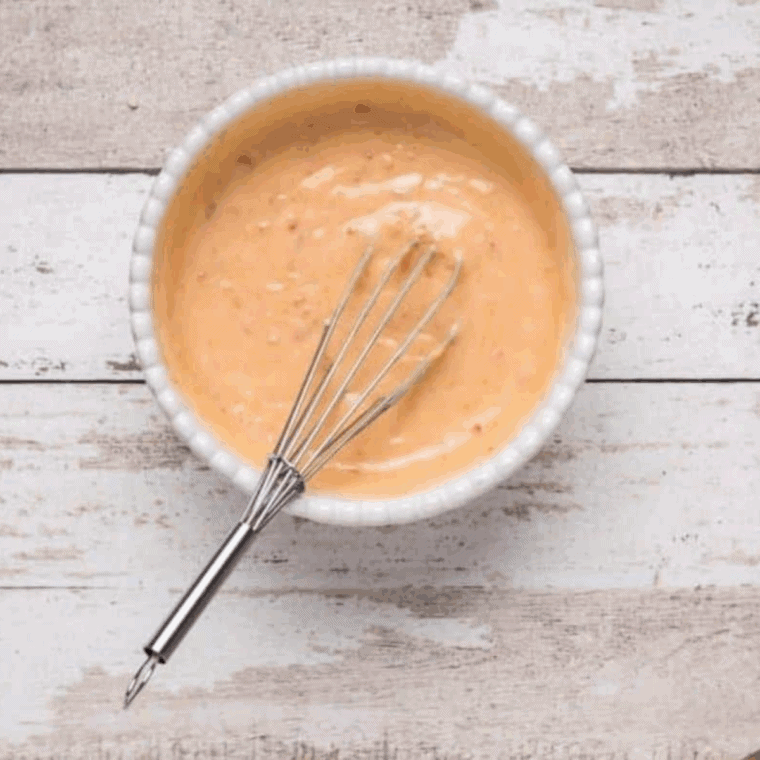 Small bowl of creamy Bang Bang Sauce made with mayonnaise, sweet chili sauce, and sriracha, ready to serve.