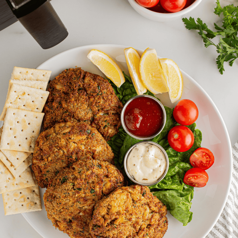 Close-up of crispy air fryer crab cakes fresh from cooking