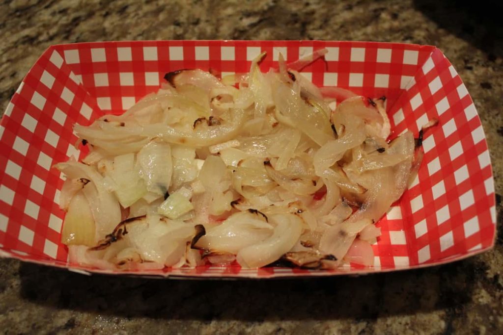 air fried onions in a red and white checkered tray