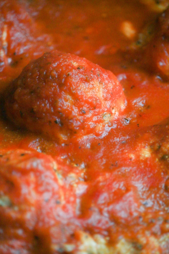Air-fried ricotta meatballs with sauce on a plate