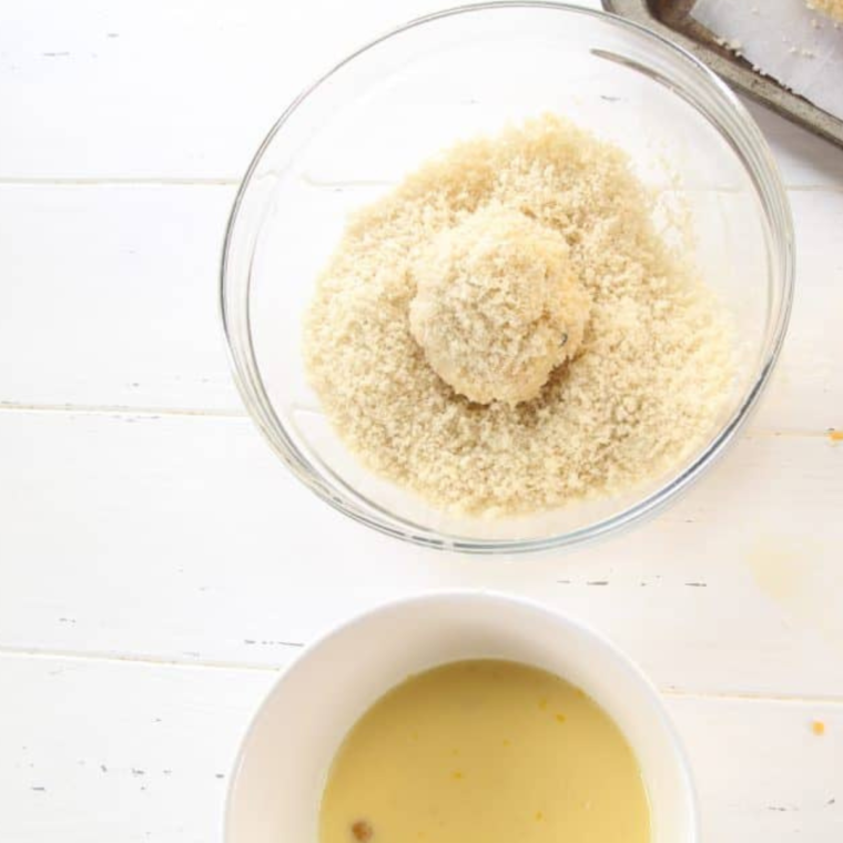 Batter the mac and cheese balls. 