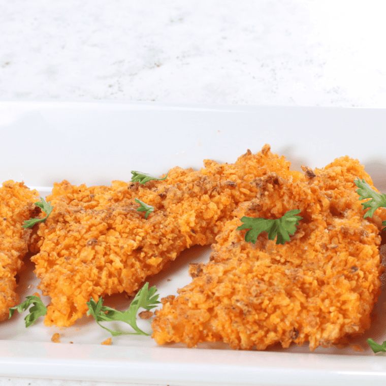 Air Fryer Cheesy Dorito Bombs with a crispy Dorito crust and melty cheese center.