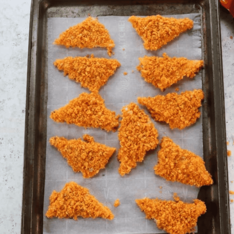 Bread the cheese and place on a parchment-lined baking sheet, then freeze for about two hours until frozen solid.