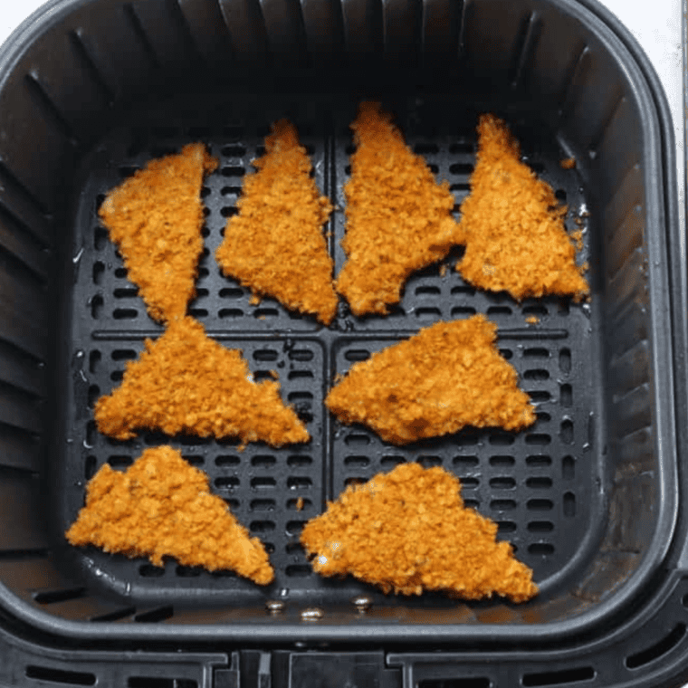 Spray air fryer basket with cooking spray, add frozen cheese bombs, set to 400°F for 6 minutes, flipping halfway.