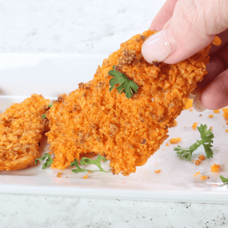 Air fryer cheesy Dorito bombs on a plate, golden and crispy, served as a tasty snack or appetizer.