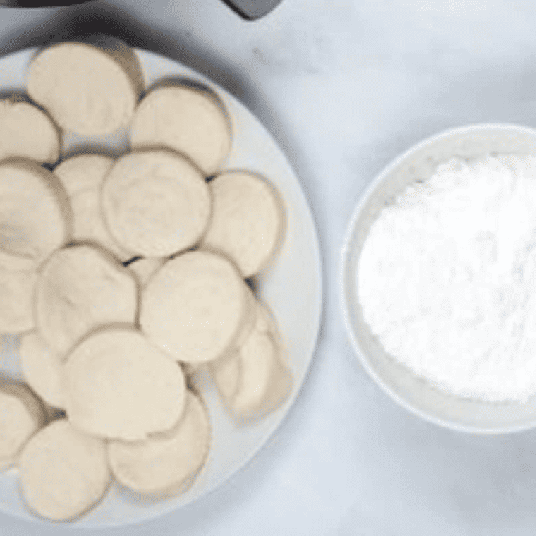 Ingredients needed for Copycat Hostess Powdered Donettes on kitchen table.