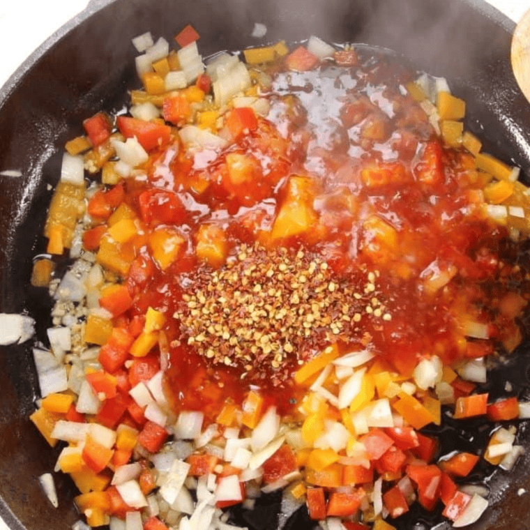 Sauté peppers, onions, and garlic in olive oil, then add sweet chili sauce and red pepper flakes until heated through.