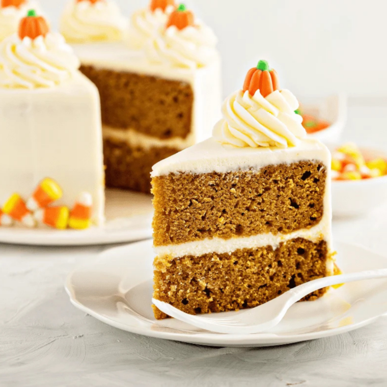 Whole air fryer pumpkin layer cake frosted with cream cheese frosting