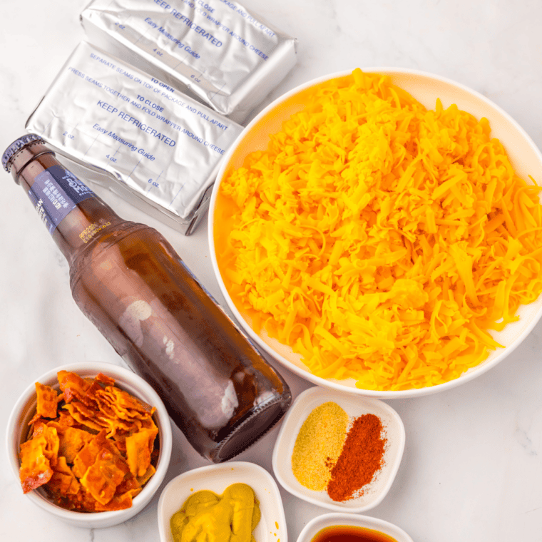 Ingredients needed for Beer Cheese Dip for Pretzels on kitchen table.