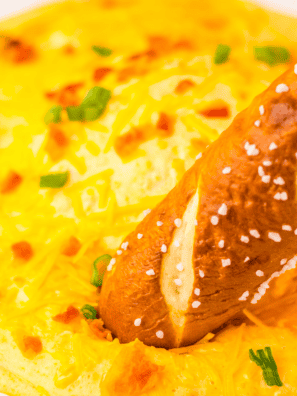 If you've ever hosted a game day or holiday get-together, you already know the truth&mdash;nobody remembers the main course, but they never forget the dip. I am absolutely obsessed with building an appetizer spread that stops people mid-conversation and has them asking for the recipe before they've even finished their first scoop. These are my tried-and-true crowd-pleasers: the ones I bring to every party and always, always come home with an empty dish. From the fiery, creamy kick of my Nashville Hot Chicken Dip to the hands-off magic of a slow cooker beer cheese, I've leaned hard into my air fryer and crockpot so I can actually enjoy the party instead of being glued to the stove. Whether you're loading up a chip, dunking a pretzel, or piling onto a cracker, every single one of these recipes is built to disappear fast. Grab your dippers and let's get this party started! 1. Easy Nashville Hot Chicken Dip Easy Nashville Hot Chicken Dip If you love the fiery kick of Nashville hot chicken, this dip is about to become your party obsession. Cream cheese and buttermilk mellow out the bold cayenne heat just enough to keep everyone coming back for one more scoop. It's creamy, spicy, and loaded with flavor&mdash;basically everything you want in a crowd-pleasing appetizer. View Recipe &rarr; 2. Air Fryer Cheddar Ranch Pickle Chips Air Fryer Cheddar Ranch Pickle Chips Crispy, cheesy, and full of flavor, these are the ultimate low-carb snack that totally steals the show at any gathering. Tangy pickles get coated in a zesty ranch-seasoned cheddar crust, then air-fried to golden perfection in minutes. They are completely addictive&mdash;don't say I didn't warn you! View Recipe &rarr; 3. Easy Slow Cooker Beer Cheese Dip Easy Slow Cooker Beer Cheese Dip Rich, creamy, and packed with bold cheesy flavor&mdash;all made completely hands-off in the crockpot. Just toss everything in, let it melt into something magical, and set it out with soft pretzels or crusty bread. It stays warm and perfectly dippable for hours with almost zero effort on your part. View Recipe &rarr; 4. Air Fryer Artichoke Dip Air Fryer Artichoke Dip This creamy, flavorful dip comes together so quickly in the air fryer, and it gets the most beautiful golden-brown top while staying luxuriously smooth underneath. Made with tender artichokes, cream cheese, and a perfect blend of spices, it's a classic appetizer that always has everyone coming back for seconds. Once you try it in the air fryer, you'll never go back to the oven! View Recipe &rarr; 5. Buffalo Ranch Dressing Buffalo Ranch Dressing Why choose between cool ranch and bold buffalo heat when you can have both in one incredible sauce? This zesty, creamy dressing is a total game-changer for wings, veggies, fries, and everything in between. It's so much better than anything from a bottle&mdash;once you make it homemade, there's no going back. View Recipe &rarr; 6. Easy Slow Cooker Jalape&ntilde;o Popper Dip Easy Slow Cooker Jalape&ntilde;o Popper Dip This dip brings all the heat and creaminess of a classic jalape&ntilde;o popper without any of the fuss. Just toss everything into the crockpot, let it melt into cheesy, spicy magic, and watch it disappear faster than you can say 'just one more bite.' It's my go-to when I want big, bold flavors with zero babysitting. View Recipe &rarr; 7. Air Fryer Taco Bites Air Fryer Taco Bites Crispy, cheesy, and packed with seasoned taco meat in every single bite&mdash;these little flavor bombs are one of my favorite ways to feed a hungry game-day crowd. Quick and easy to make in the air fryer, they come out perfectly golden every time. Dunk them in salsa or guacamole and just try to eat only one. View Recipe &rarr; 8. Cream Cheese Spread with Warm Cherry Sauce Cream Cheese Spread with Warm Cherry Sauce This simple yet elegant appetizer tastes like dessert, and it could not be easier to pull together. Smooth, creamy cheese topped with a warm, sweet-tart cherry sauce creates the most amazing flavor contrast that feels totally fancy without any real effort. It's my secret weapon for holiday entertaining and last-minute guests. View Recipe &rarr; 9. Homemade French Onion Dip Homemade French Onion Dip This is one of America's all-time favorite dips, and the homemade version is on a completely different level from anything in a store-bought tub. It's rich, savory, and so easy to throw together&mdash;perfect for impromptu gatherings or late-night chip dipping straight from the fridge. Once you go homemade, you'll never look back! View Recipe &rarr;