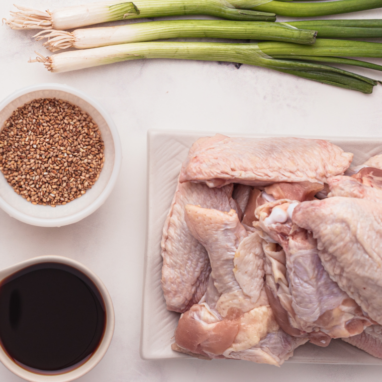 Ingredients needed for Copycat Buffalo Wild Wings Buffalo Wings on a white table. With seasoning on the side.