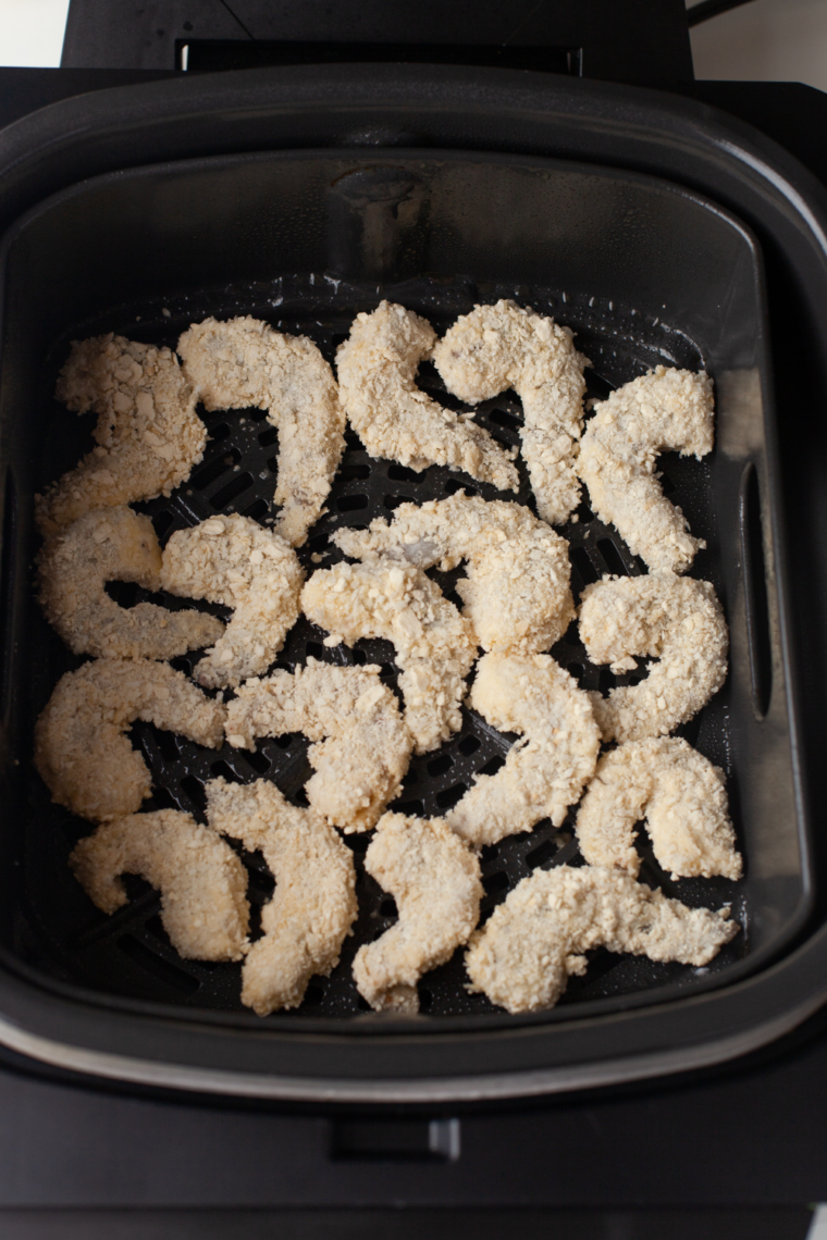 Air fryer basket sprayed with cooking spray and preheating to 400 degrees Fahrenheit.