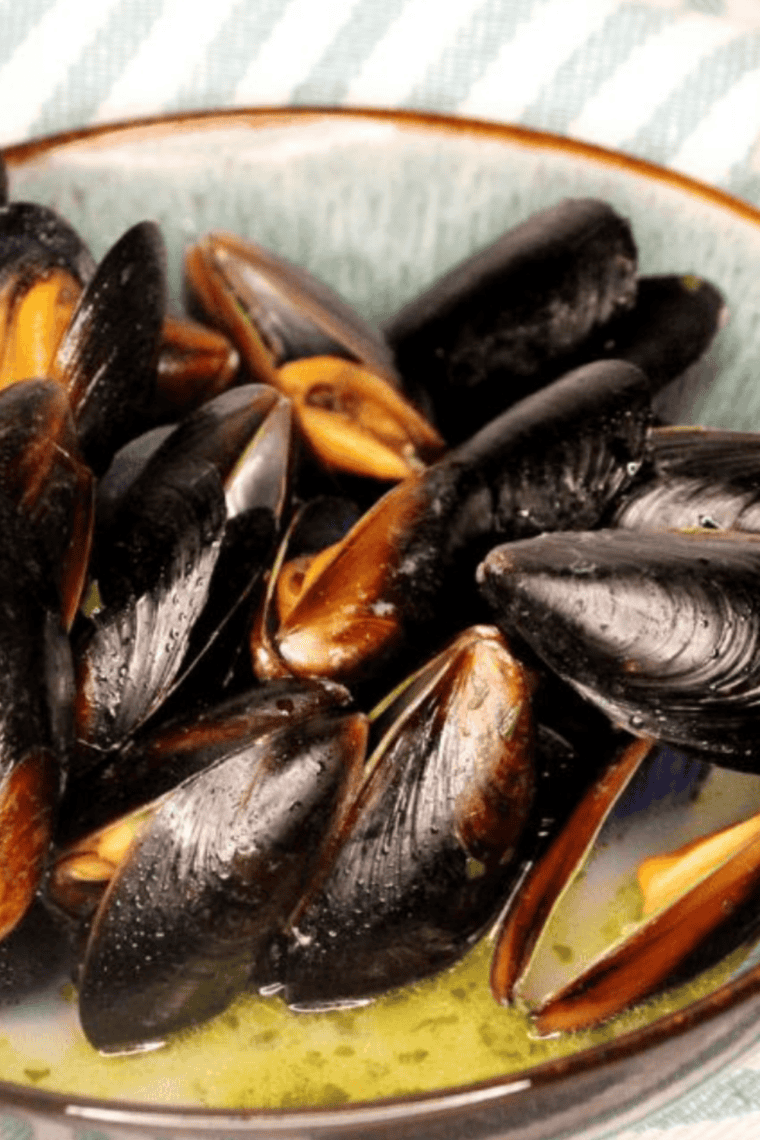 Plate of Easy Bonefish Grill Mussel Recipe with sauce.