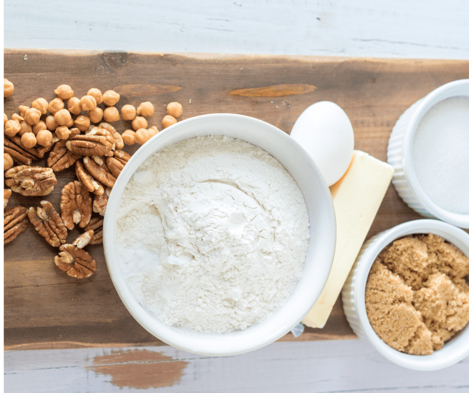 Ingredients Needed For Giant Caramel Pecan Air Fryer Cookie On Wooden Board