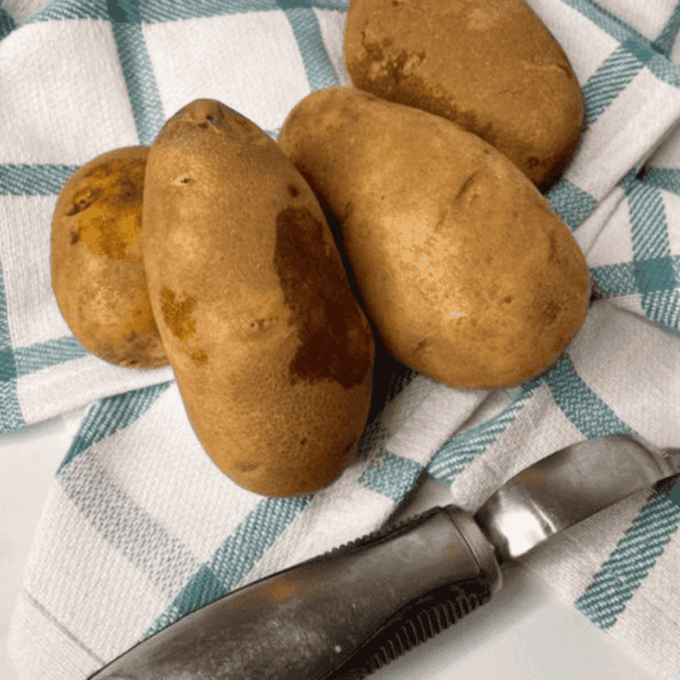 Ingredients needed for Red Lobster Baked Potato Recipe on kitchen table.