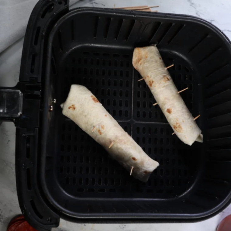 Place pizza sticks into the air fryer basket.