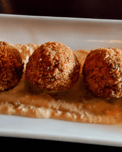 Air fryer boudin balls are a delicious and easy way to enjoy this classic Cajun dish. Made with pork, rice, and spices, boudin balls are typically deep-fried. However, air frying them gives them a crispy exterior without all the extra oil. And, since they're bite-sized, they're perfect for popping in your mouth! Best of all, they can be made ahead of time and frozen for a quick and easy snack or appetizer. Simply reheat in the air fryer when you're ready to enjoy. So next time you're in the mood for something different, give Air Fryer Boudin Balls a try - you won't be disappointed!