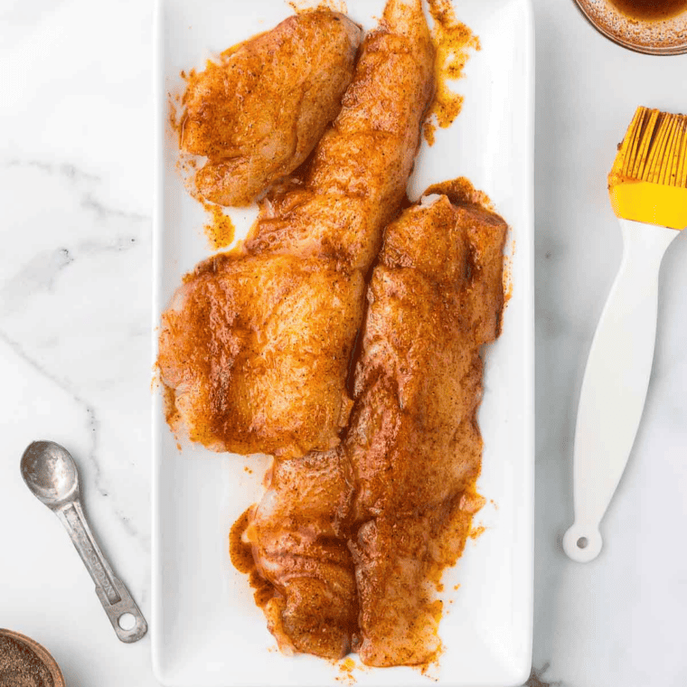 Season: Fish brushed with olive oil, seasoned with salt, pepper, garlic, lemon slices, and fresh herbs.