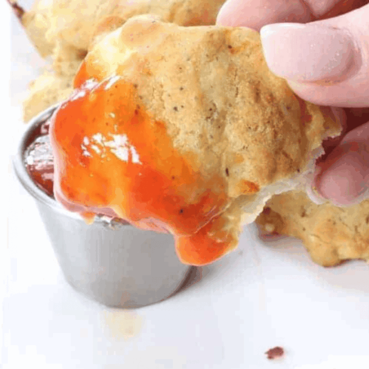 Plate of crispy air fryer copycat McDonald’s chicken nuggets with dipping sauce.