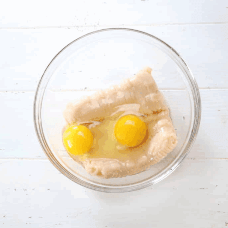 Add the ground chicken and eggs into a large mixing bowl.