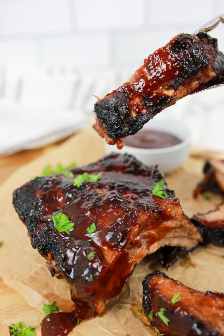 A plate of juicy, golden brown Air Fryer Fireball Glazed Ribs with a glossy, cinnamon-infused glaze.