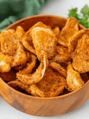 Golden, crispy air fryer frozen onion petals served in a bowl with dipping sauce