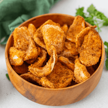 Golden, crispy air fryer frozen onion petals served in a bowl with dipping sauce