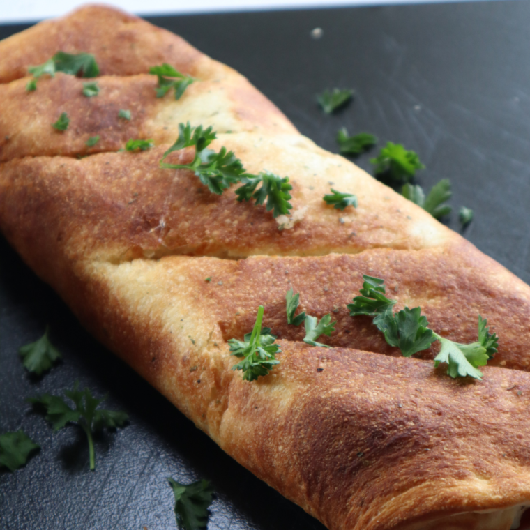 Air Fryer Italian Stromboli with golden, crispy crust and gooey cheese.