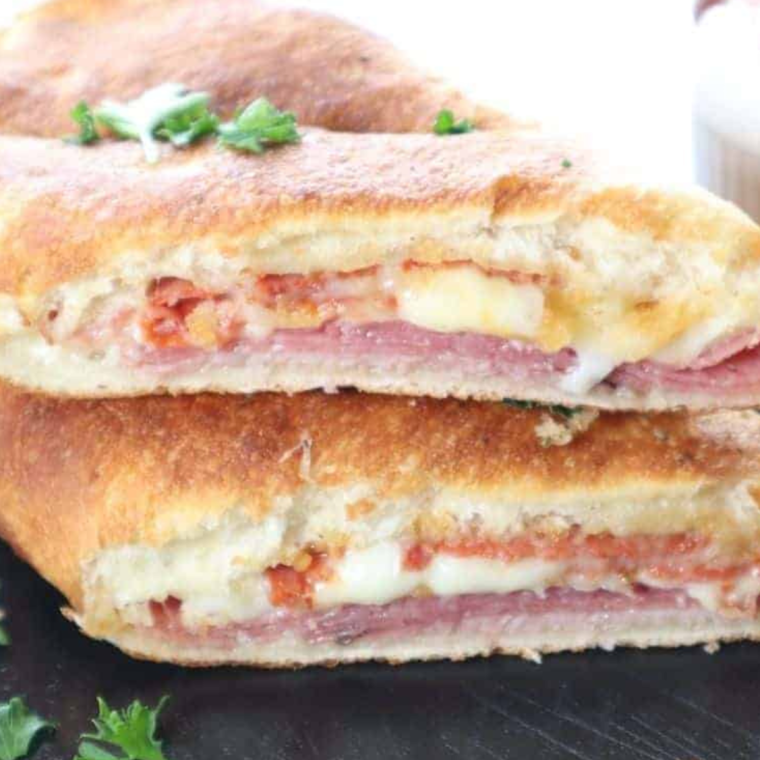 Delicious homemade Air Fryer Italian Stromboli filled with Italian meats, provolone, and mozzarella, baked to crispy perfection.