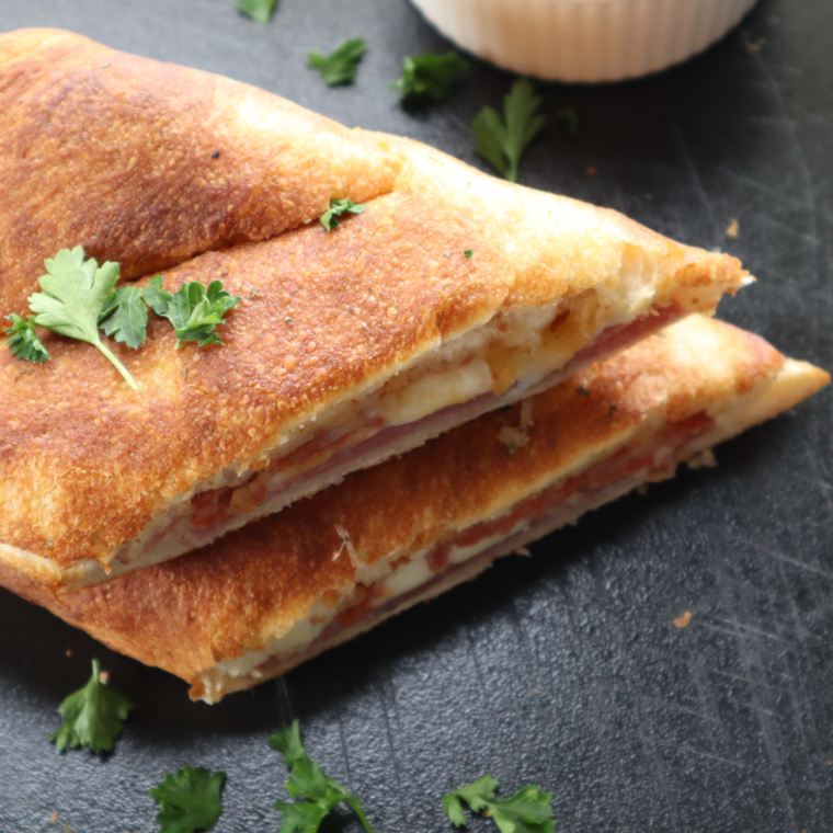 Golden, crispy Air Fryer Italian Stromboli filled with Italian meats, cheese, and marinara sauce.