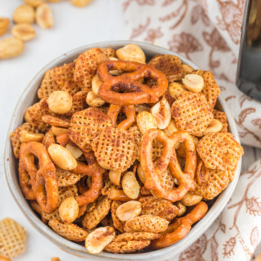 Nuts and Bolts in bowl on a table with pink and white napkin on the side