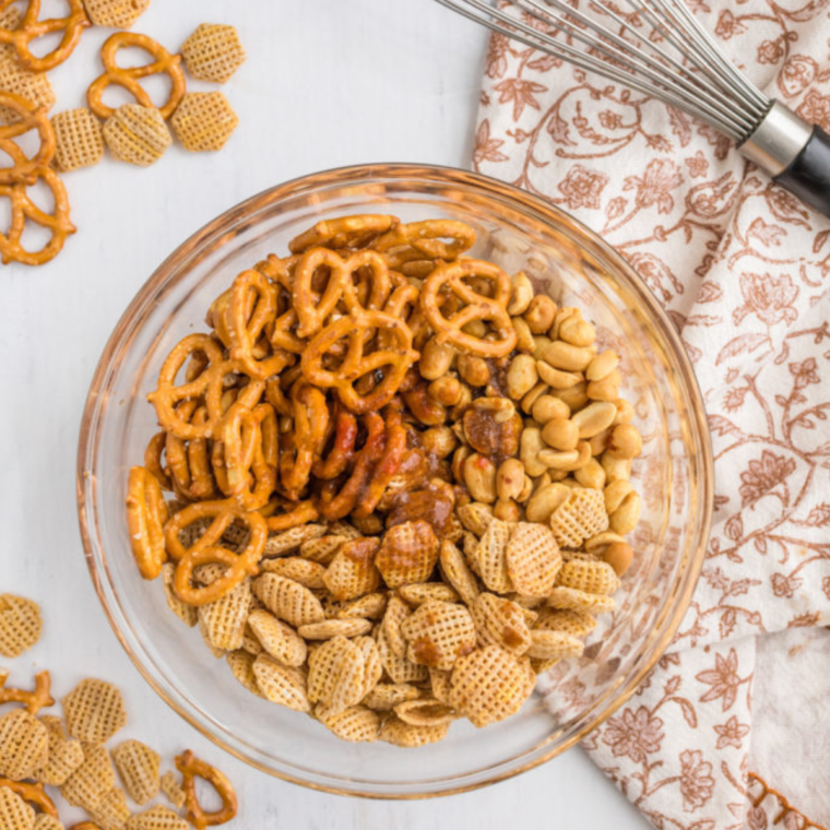 Add all of the nuts and bolts in a large bowl, to mix all of the ingredients. 