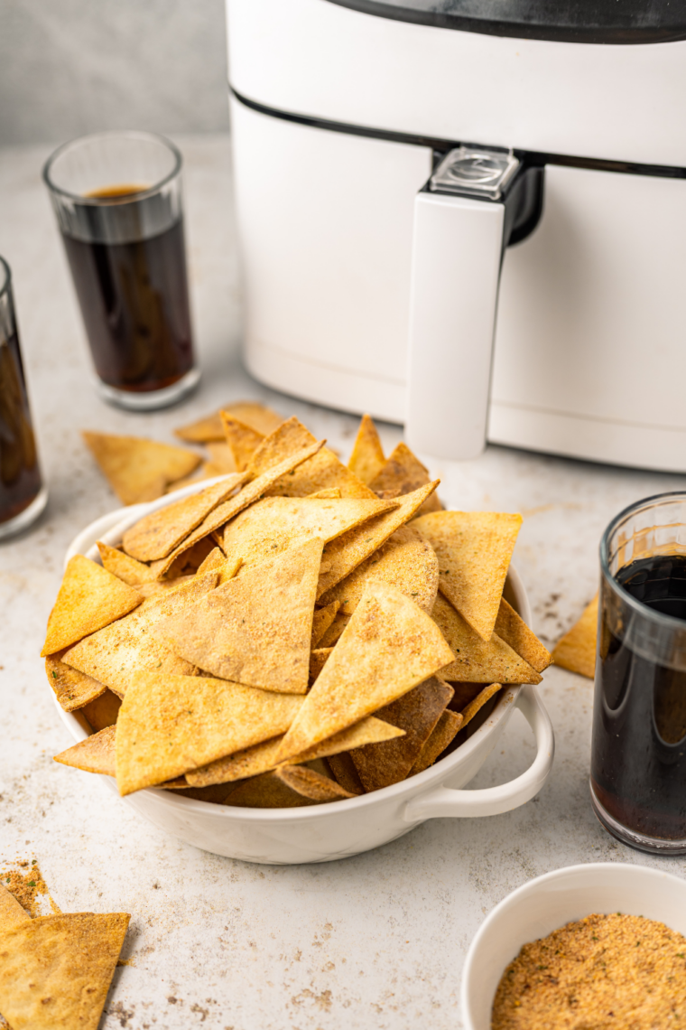 Golden crispy air fryer taco tortilla chips served in a white bowl