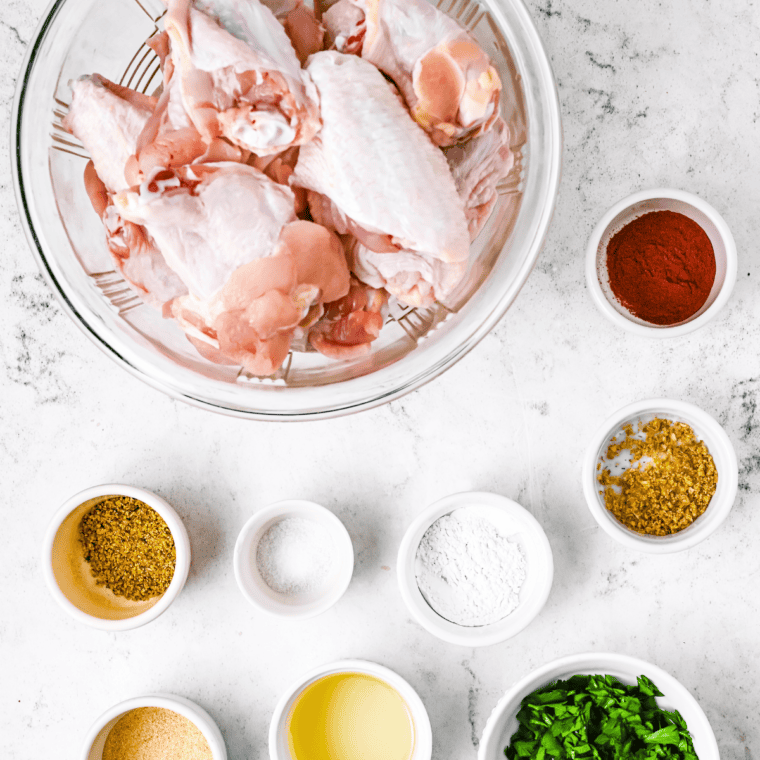 Ingredients needed for Copycat Wingstop Mild Chicken Wing Recipe on kitchen table.