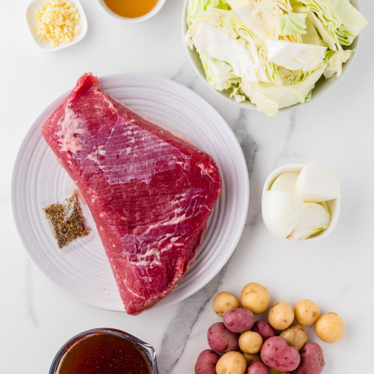 Ingredients needed for Easy Air Fryer Corned Beef Brisket on kitchen table.