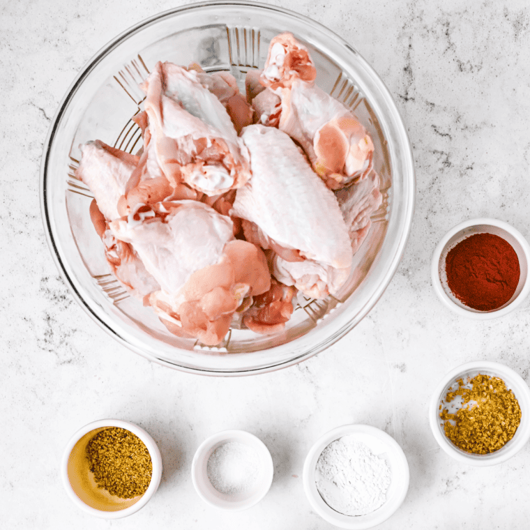 Ingredients needed for Easy Wingstop Hickory Smoked BBQ Chicken Wing Recipe on kitchen table.