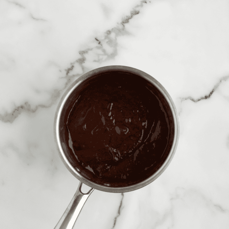 Simmering butter, BBQ sauce, honey, and vinegar for wing coating.