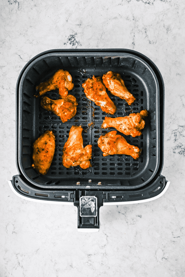 Cooked Easy Wingstop Hot Honey Rub Wings in the air fryer basket.