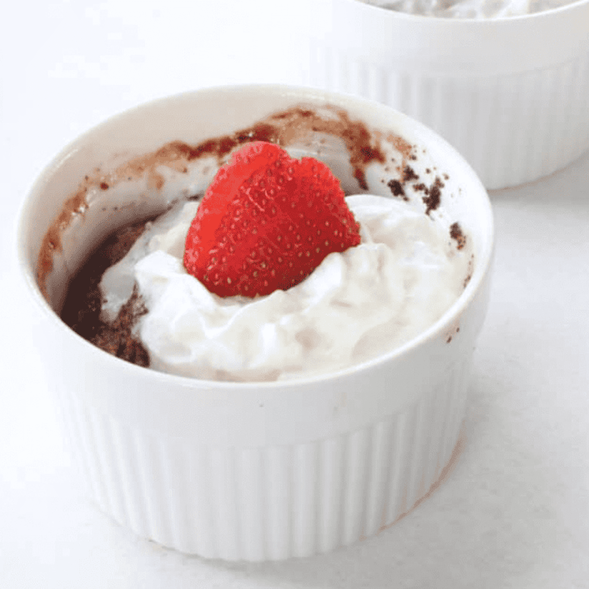 Golden Corral-style bread pudding with golden custard topping served on a plate.