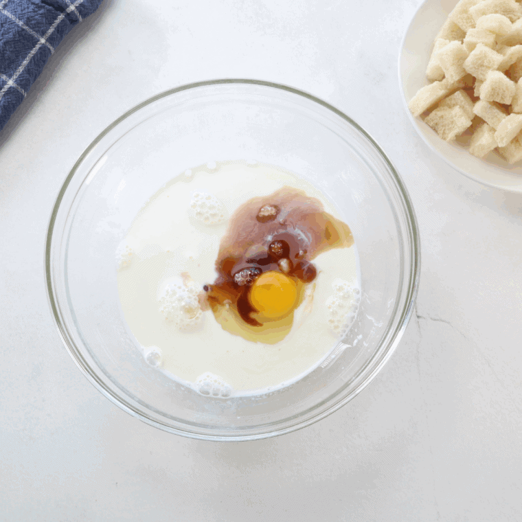 Mixing sugar, milk, half and half, egg, vanilla, and salt together in a large bowl to create the milk mixture.