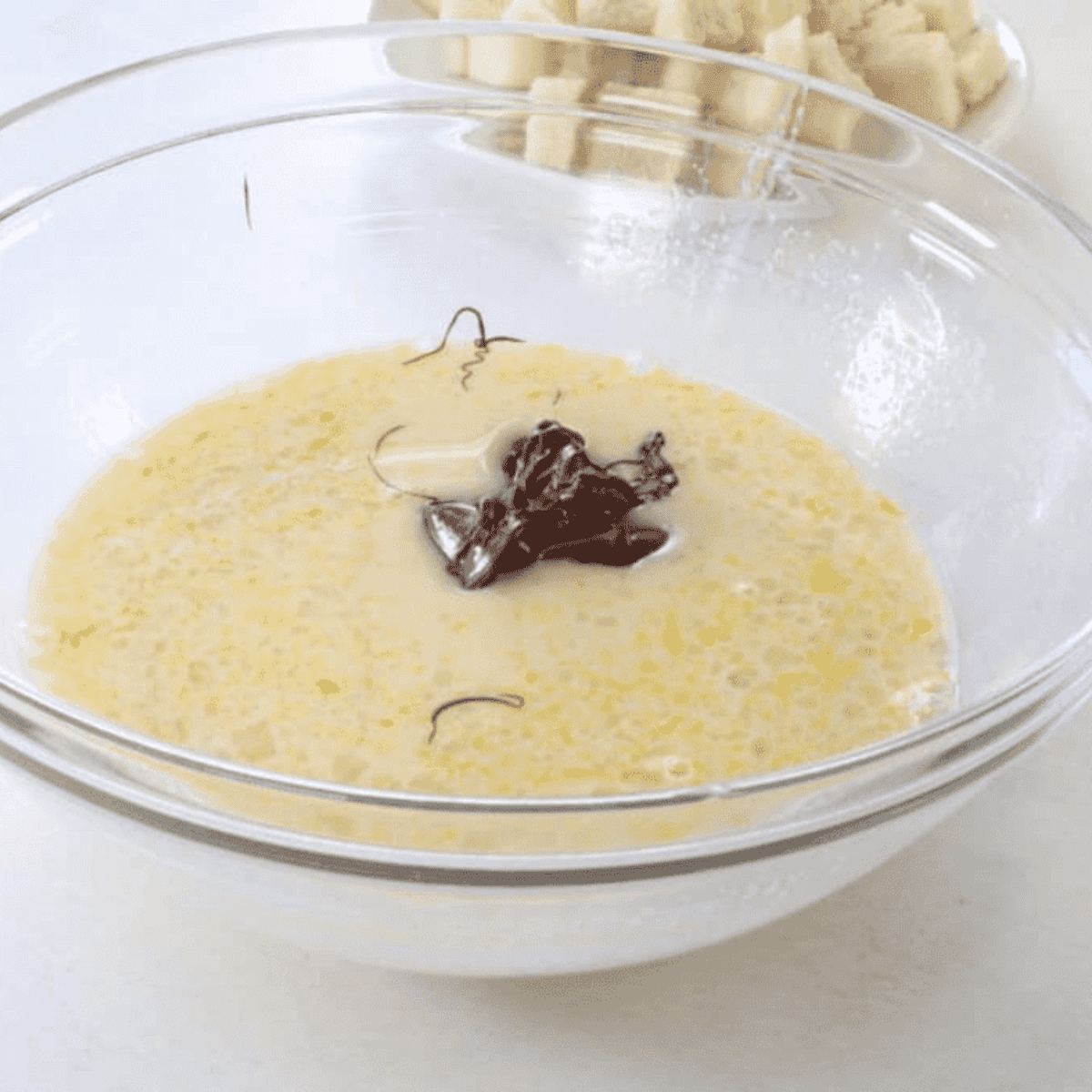 Combining melted chocolate mixture in a large bowl and stirring until smooth.