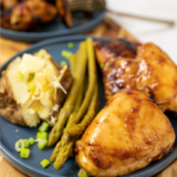 Crispy reheated chicken thighs from the air fryer on a plate