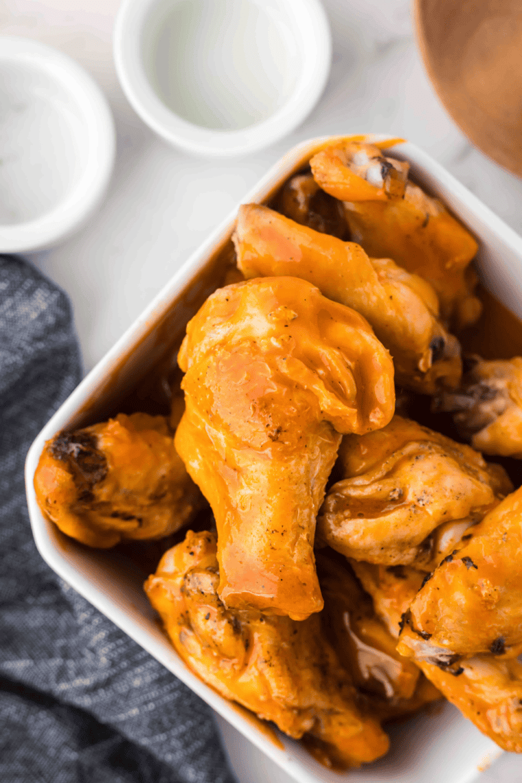 Plate of Wingstop Original Hot copycat chicken wings with spicy buffalo sauce and dipping sauce.&rdquo;