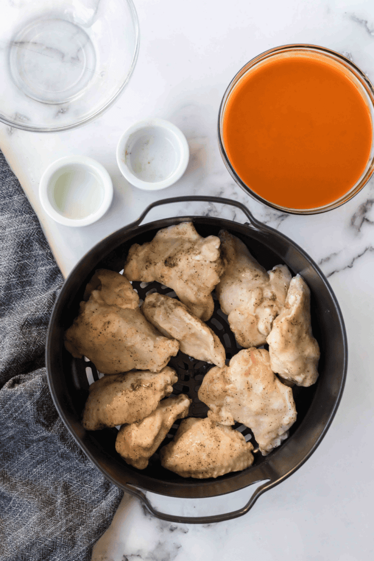 Cooking chicken wings until golden and crispy using air fryer, oven, or skillet.