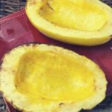 air fryer spaghetti squash on a dark red platter